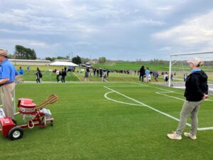 Visitors at a recent FIFA Field Day event near a simulated soccer field.